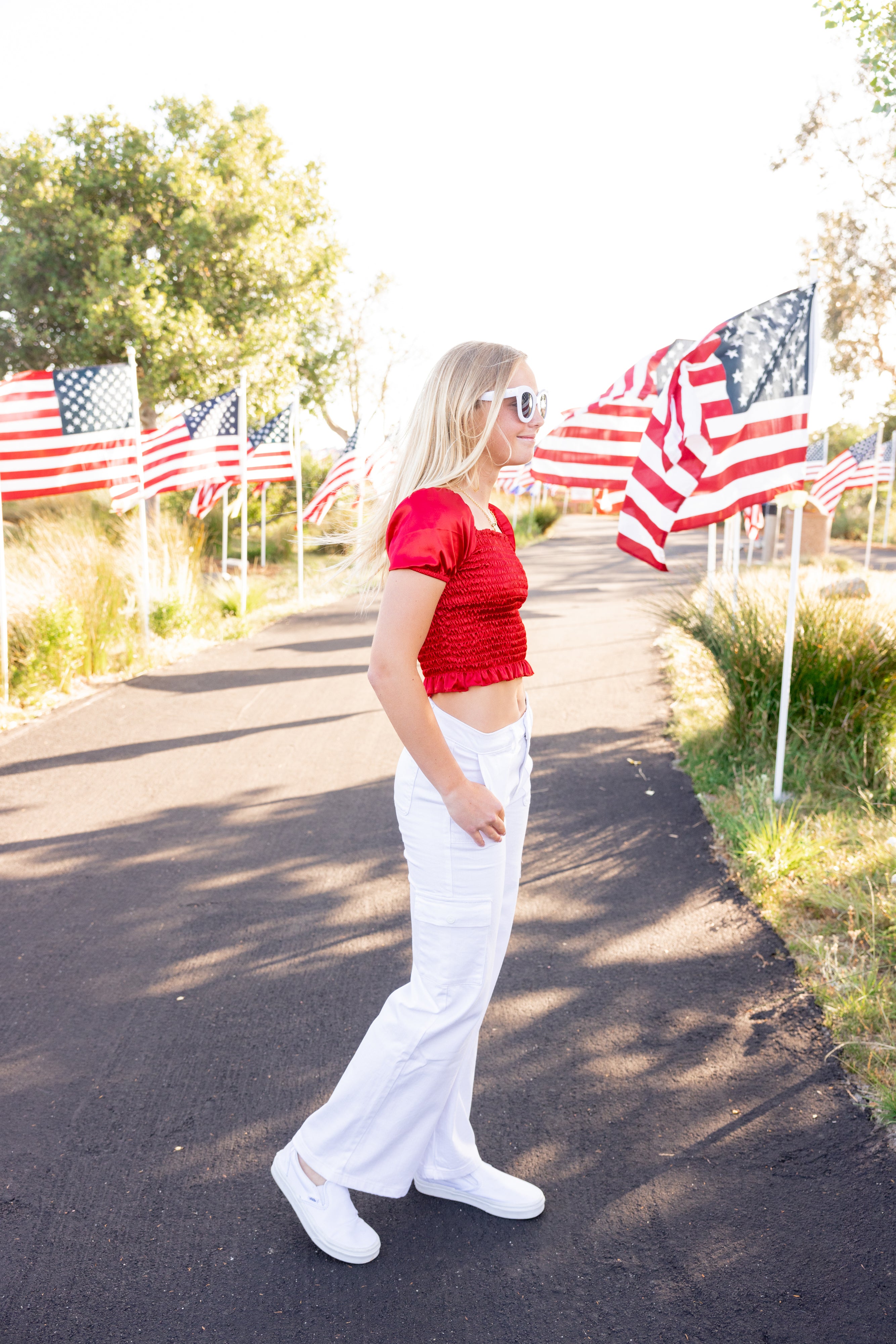 Red satin top with cargo white jeans. Fourth of july inspo outfit for tweens 2024 by leypop shoppe llc newport beach ca