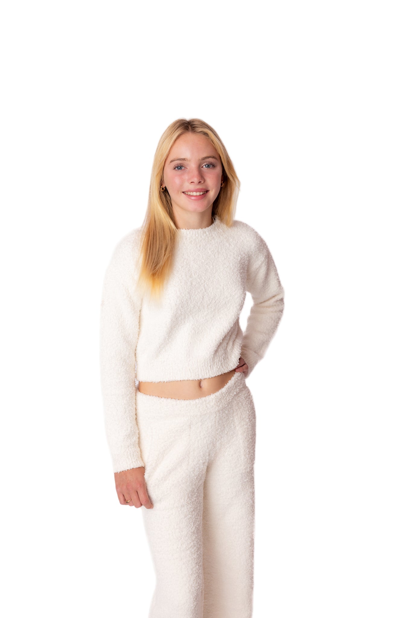 Person wearing a white outfit on a white background