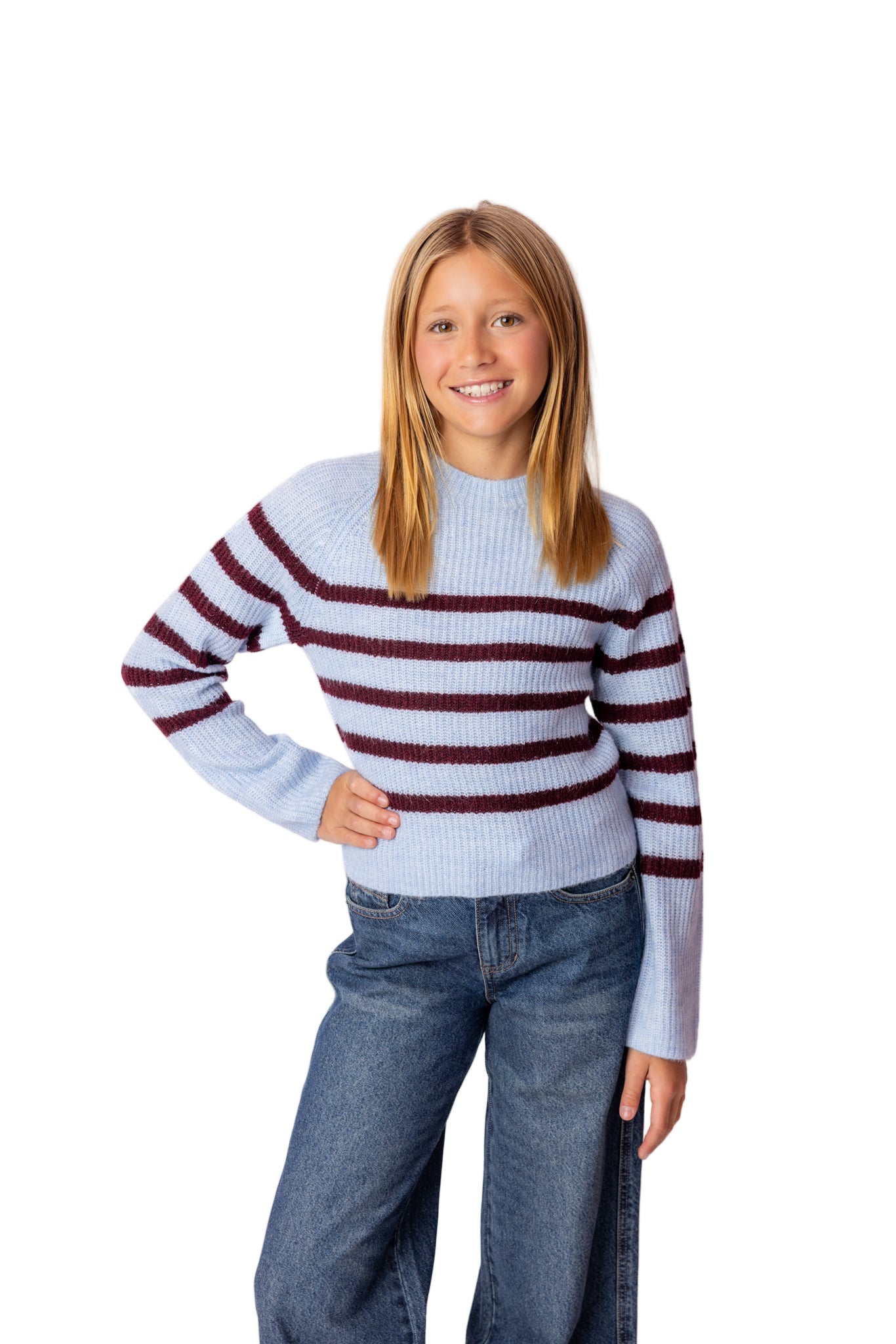 Tween wearing a striped sweater and jeans from viral online tween shop in newport beach.
