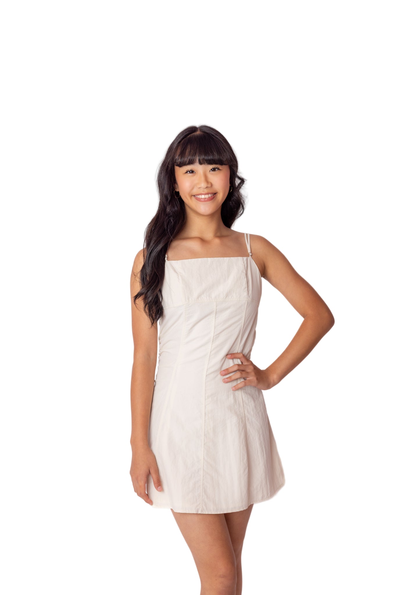 Teen girl wearing a cream dress