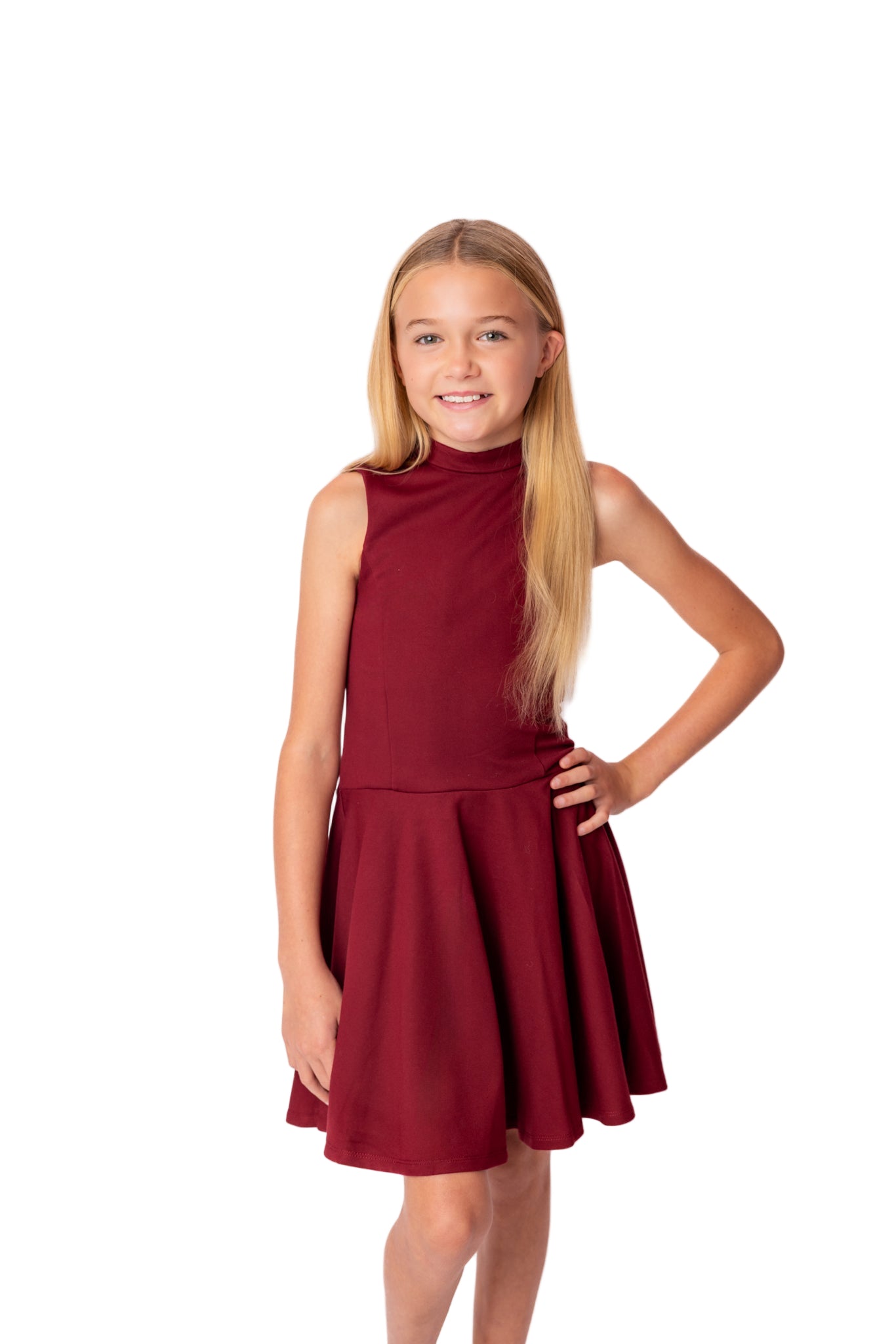Young girl wearing a red dress on a white background