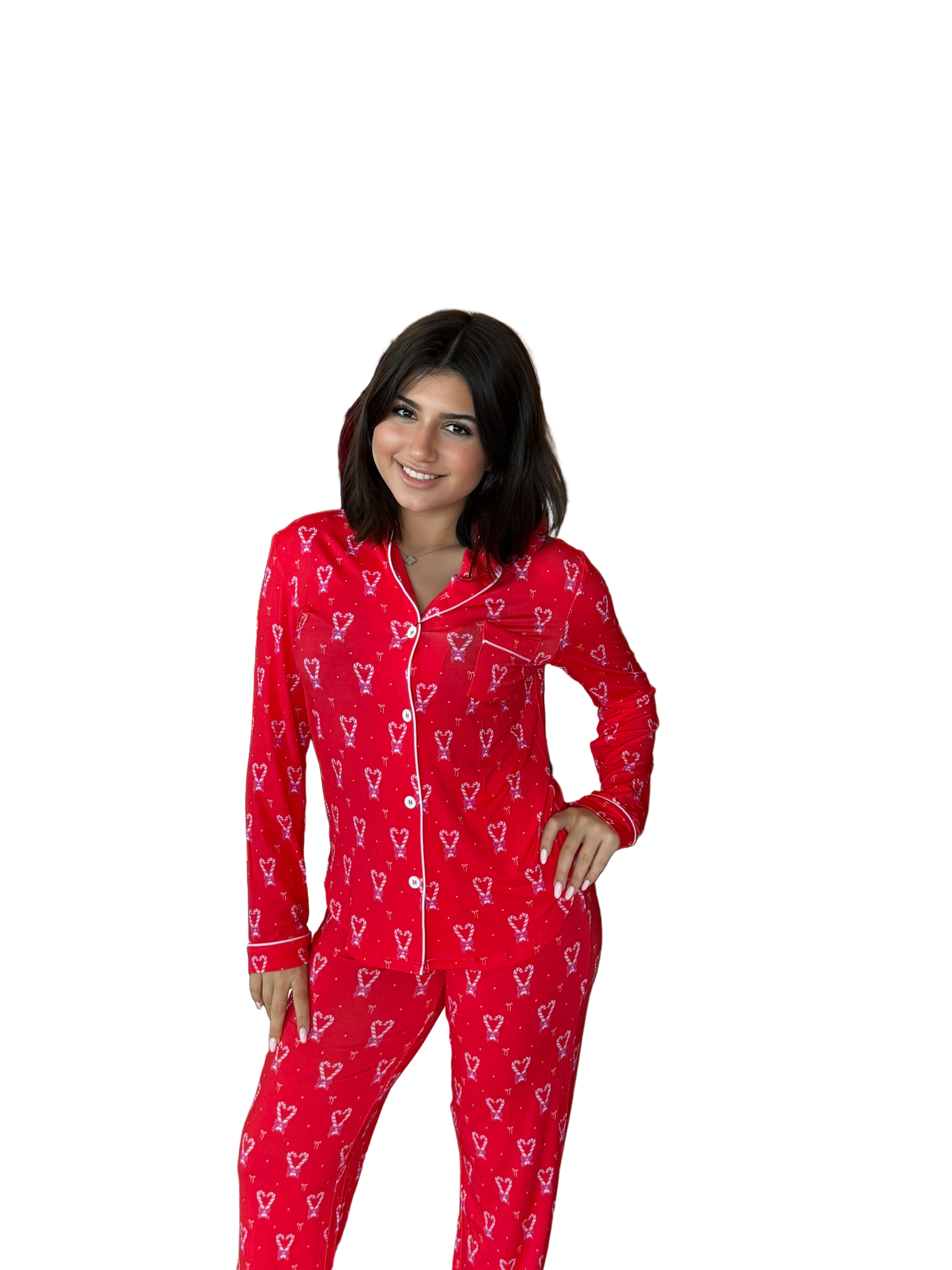 Woman wearing red pajamas with Christmas heart patterns in a store setting from katiej