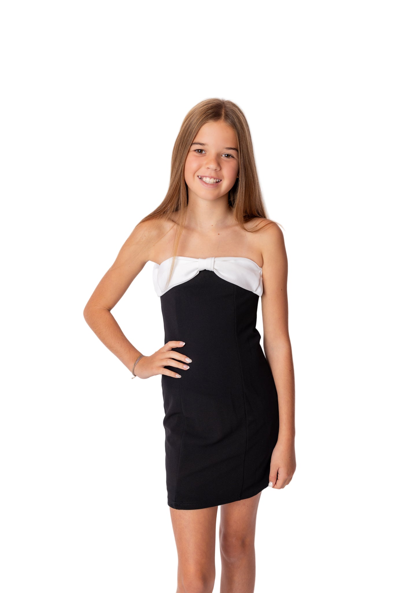 Young teen girl wearing a black and white party dress. KatieJ NYC Orange County teen store. Edikted for kids.