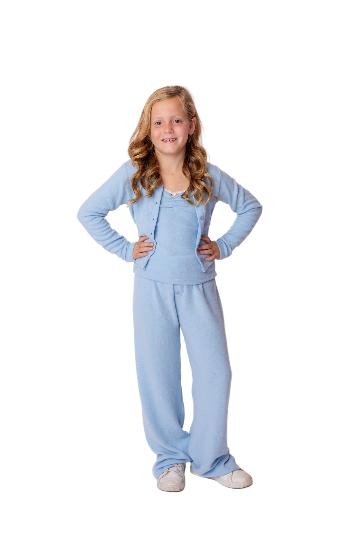Young girl wearing a light blue outfit on a white background