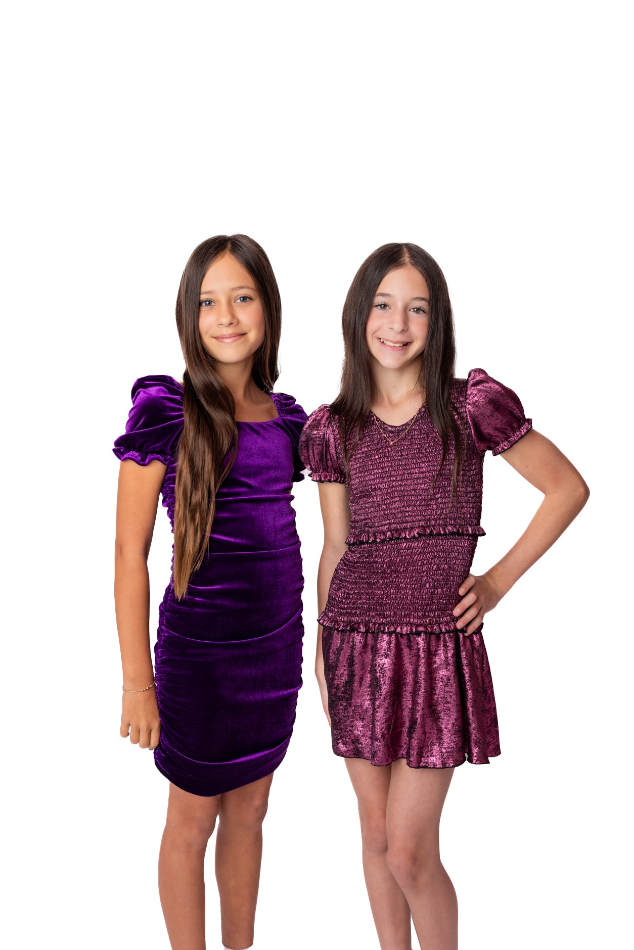 Young girl wearing a purple dress with puffed sleeves on a white background from Newport Teen Store Viral online shop.
